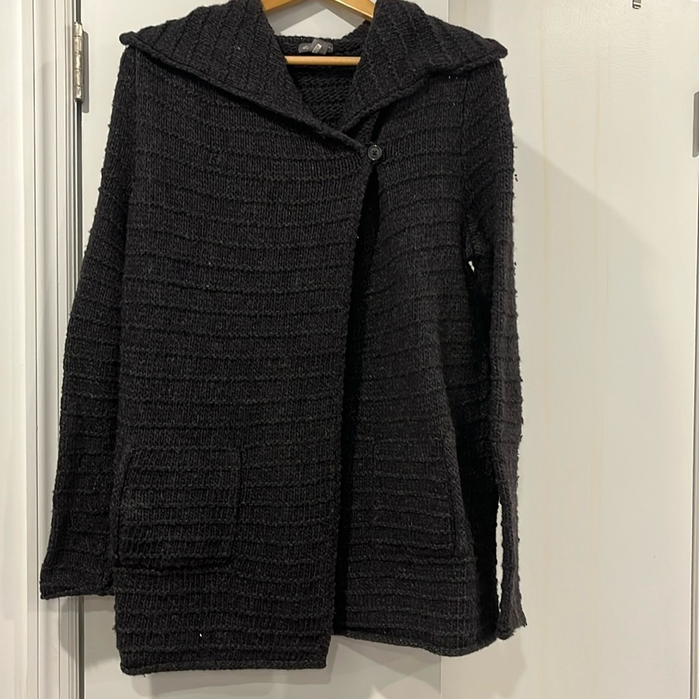 Sweater cape. Warm with pockets.